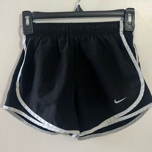 Black with while stripe. XS shorts